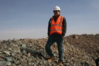 Worker at rock pile